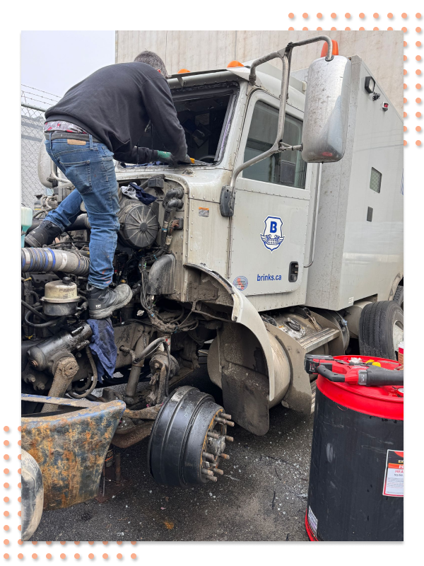 A technician performing a DOT inspection